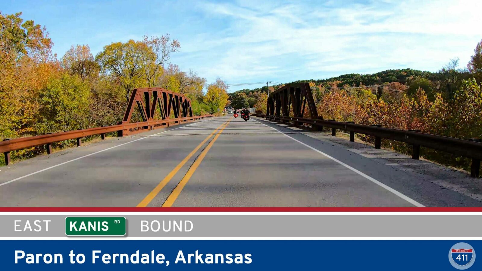 Drive America's Highways for 13 miles east along Kanis Road from Paron to Ferndale in Arkansas.